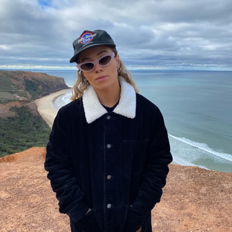 Photo-by-TASH-SULTANA-on-August-19-2024.-May-be-an-image-of-1-person-hat-parka-Uluru-ocean-and-text.jpg