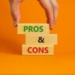 167247506-pros-and-cons-symbol-wooden-blocks-with-words-pros-and-cons-beautiful-orange-background.jpg